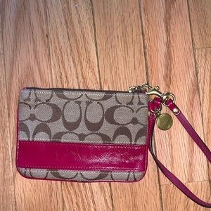 Maroon striped signature Coach wristlet
